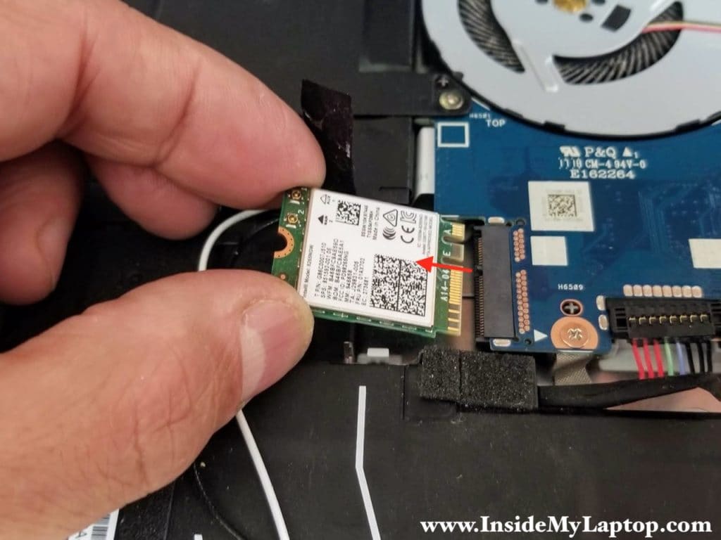 Remove one screw securing the Wi-Fi card and pull it out.