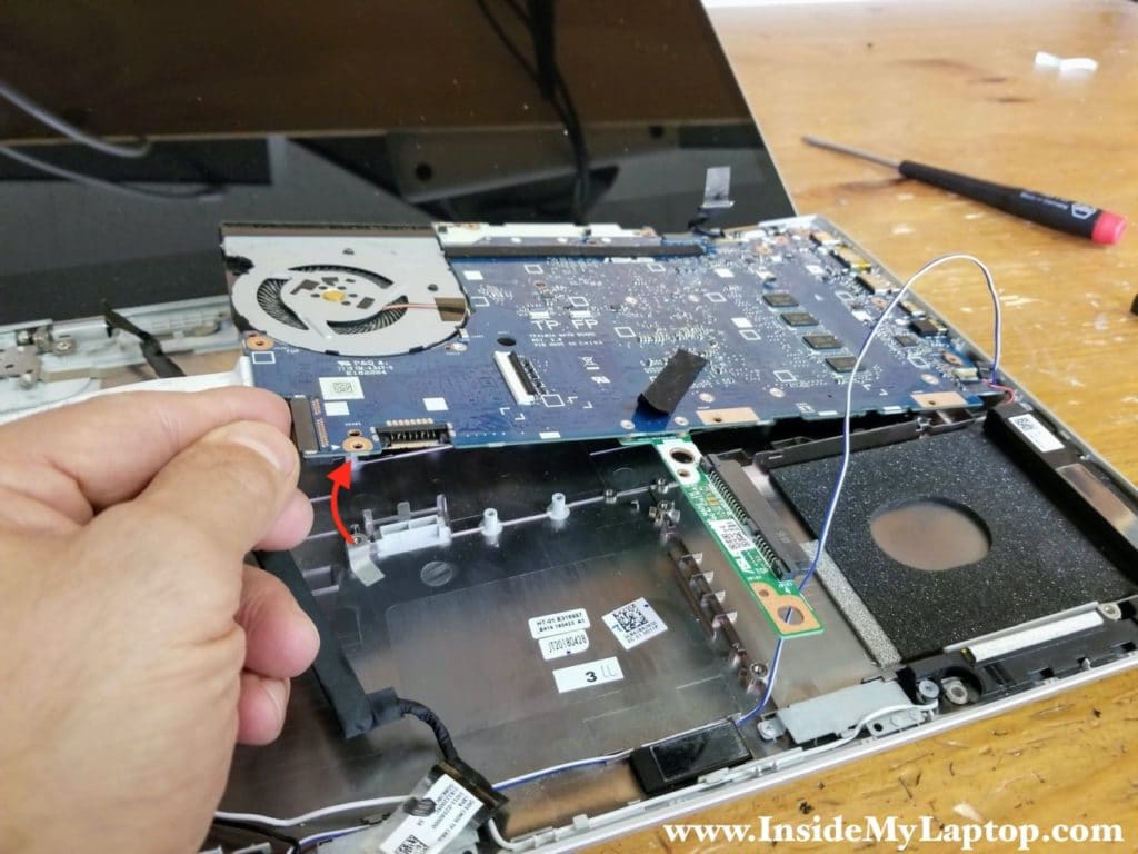 Separate the motherboard from the laptop base.