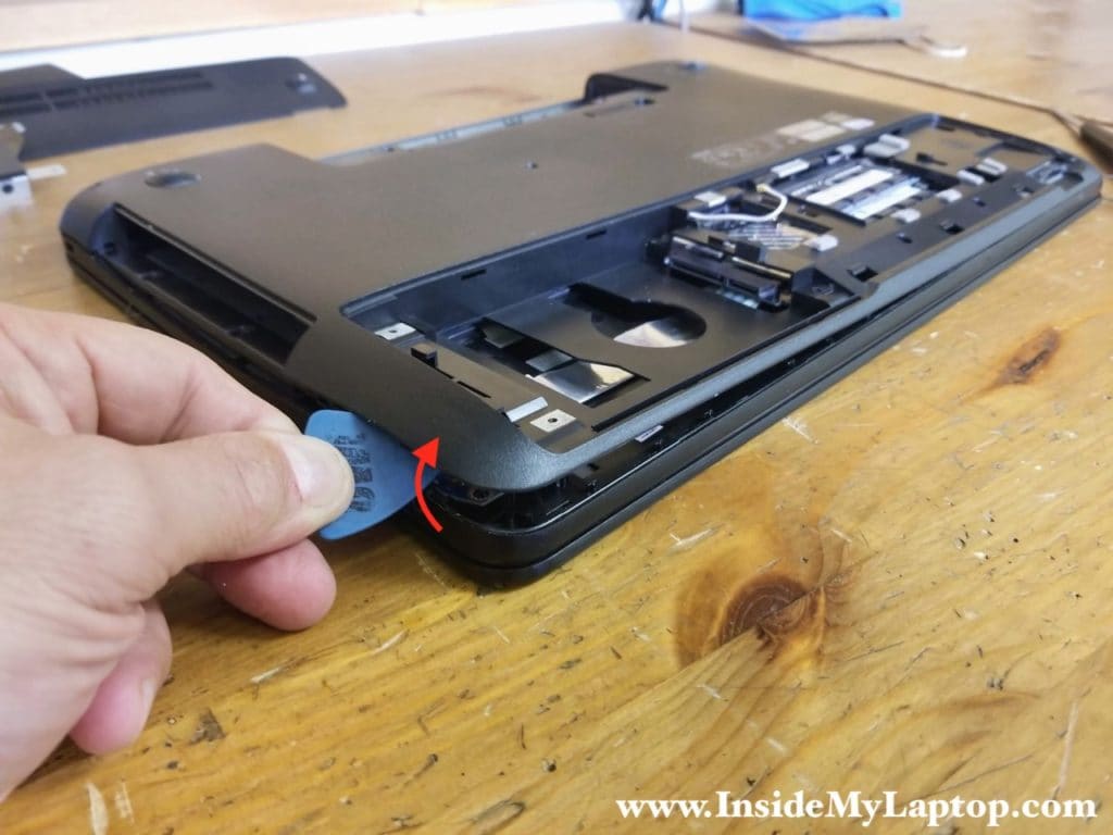 Separate the laptop base from the top case assembly.