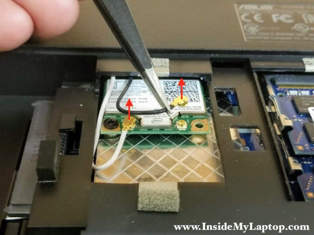 Disconnect both antenna cables from the wireless card.