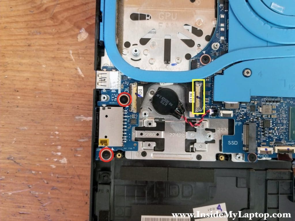 Remove two screws securing the USB SD card reader board. Disconnect the I/O cable from the motherboard.