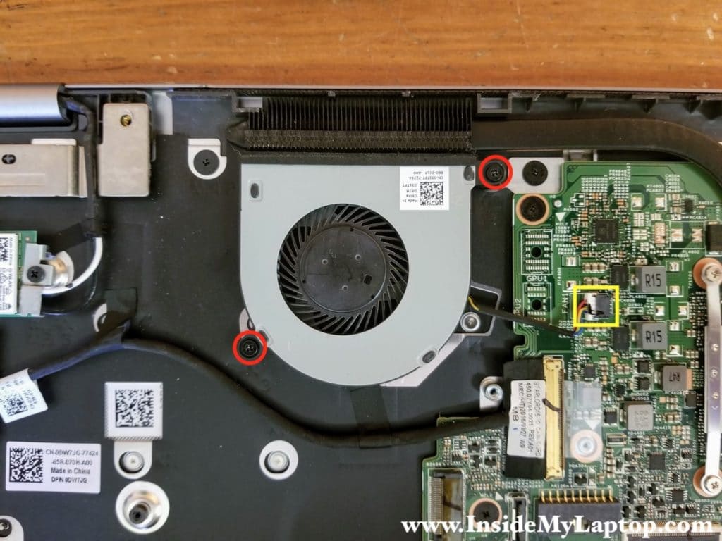 Remove two screws from the cooling fan and disconnect the fan cable.