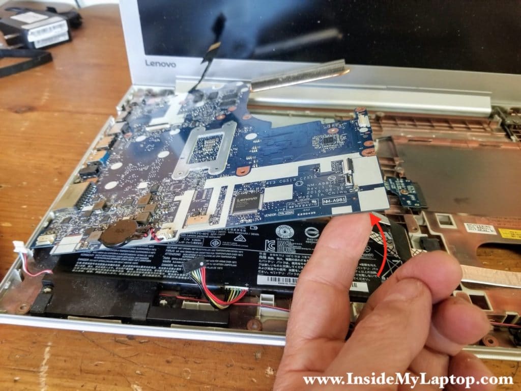 Lift up and remove the motherboard.