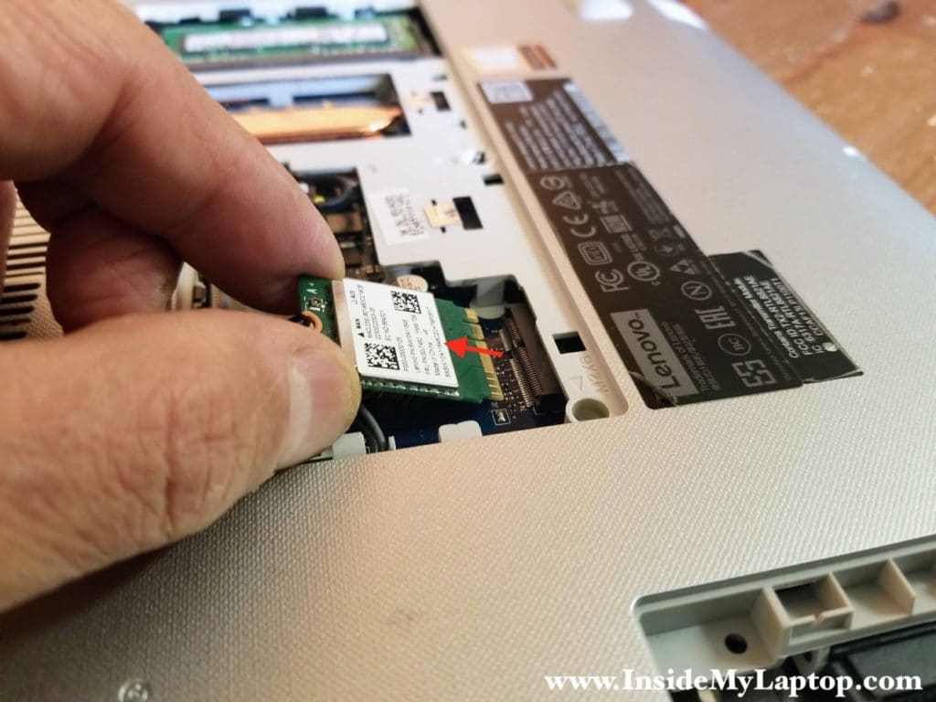 Remove the wireless card from the slot.