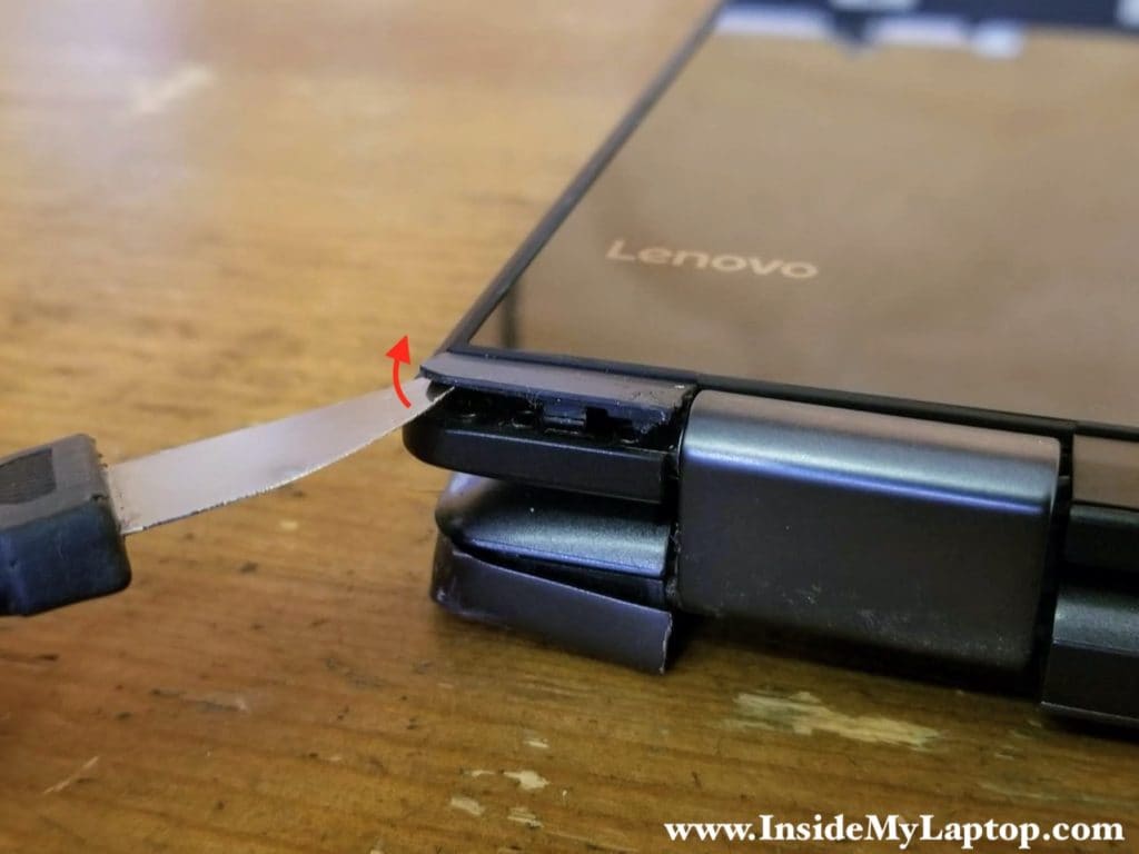 Using a thin case opener tool pry up the hinge cover.