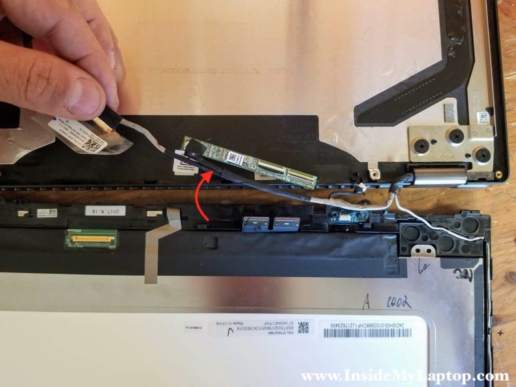 Separate the digitizer board and all the cables from the lower side of the touchscreen assembly.