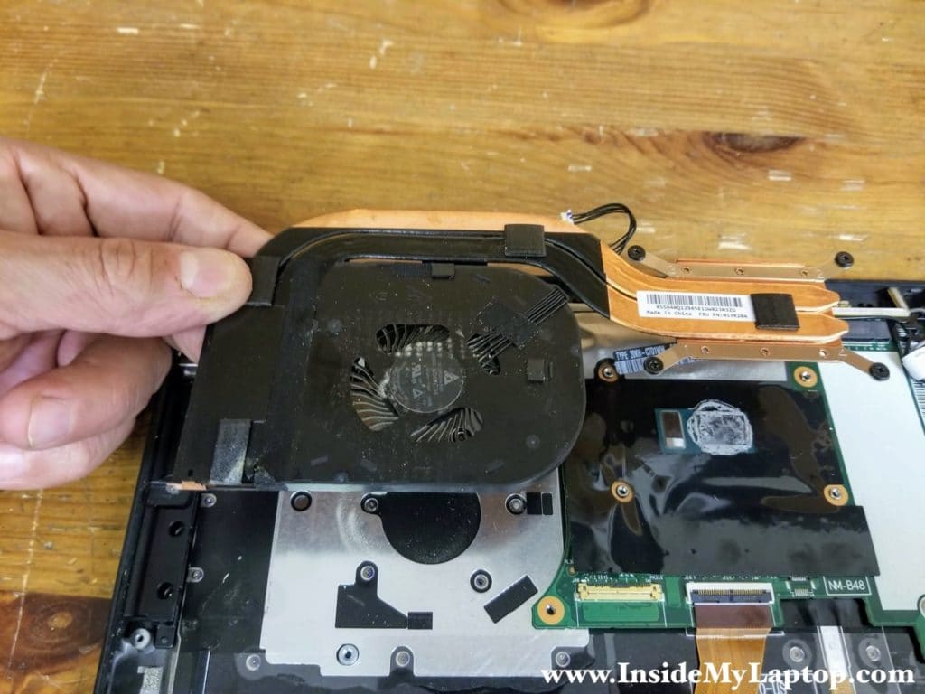 Lift up the cooling module (heatsink with fan) and remove it.