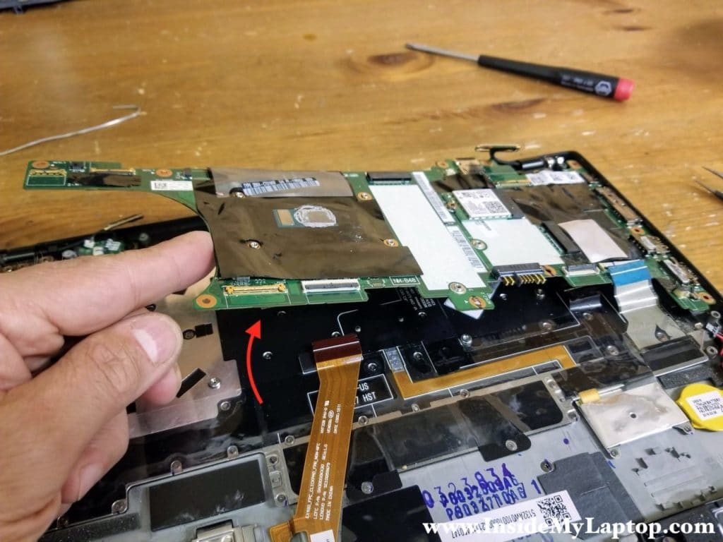 Lift up the motherboard and remove it.