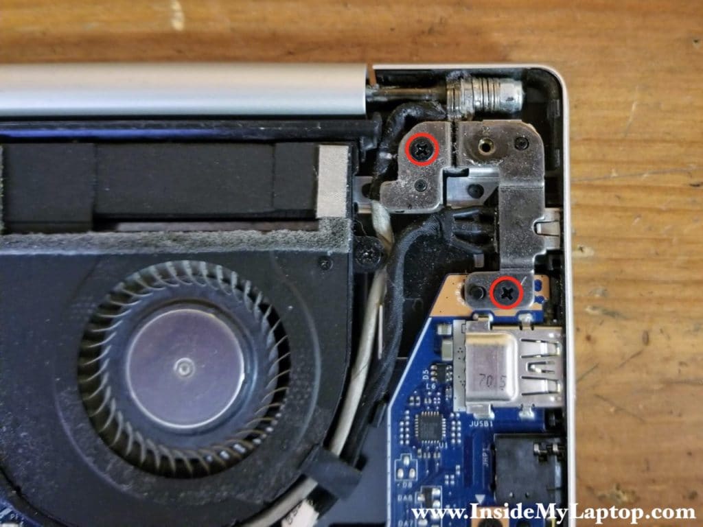 Remove two screws from the left display hinge.