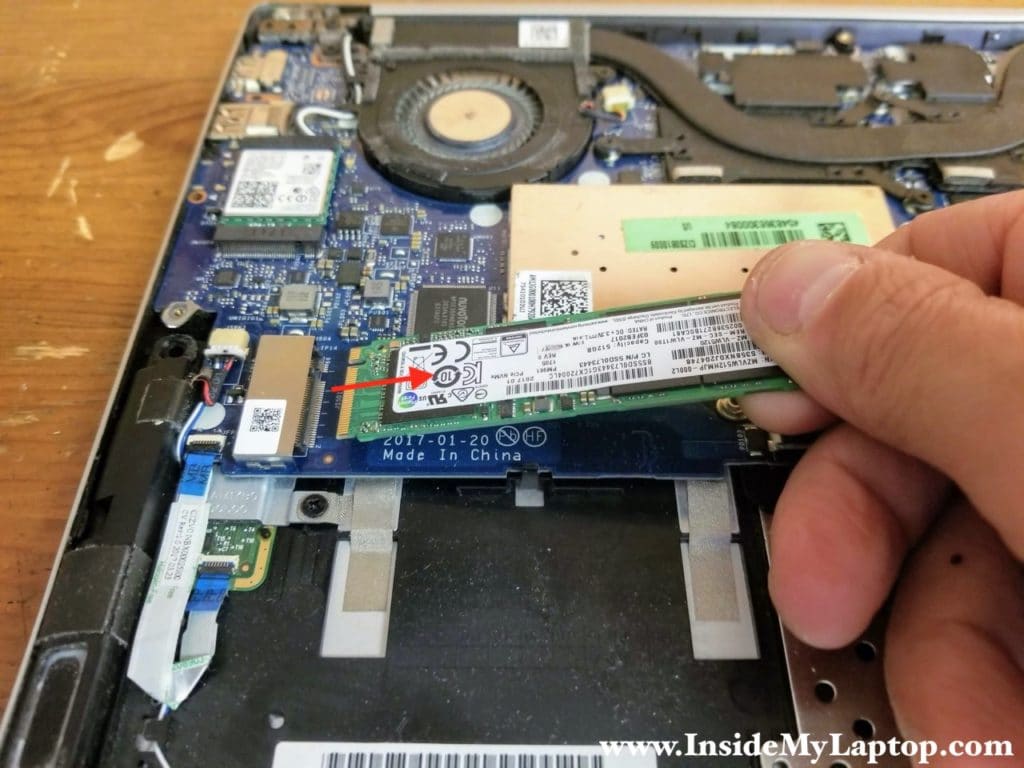 Remove one screw securing the SSD and remove the SSD.