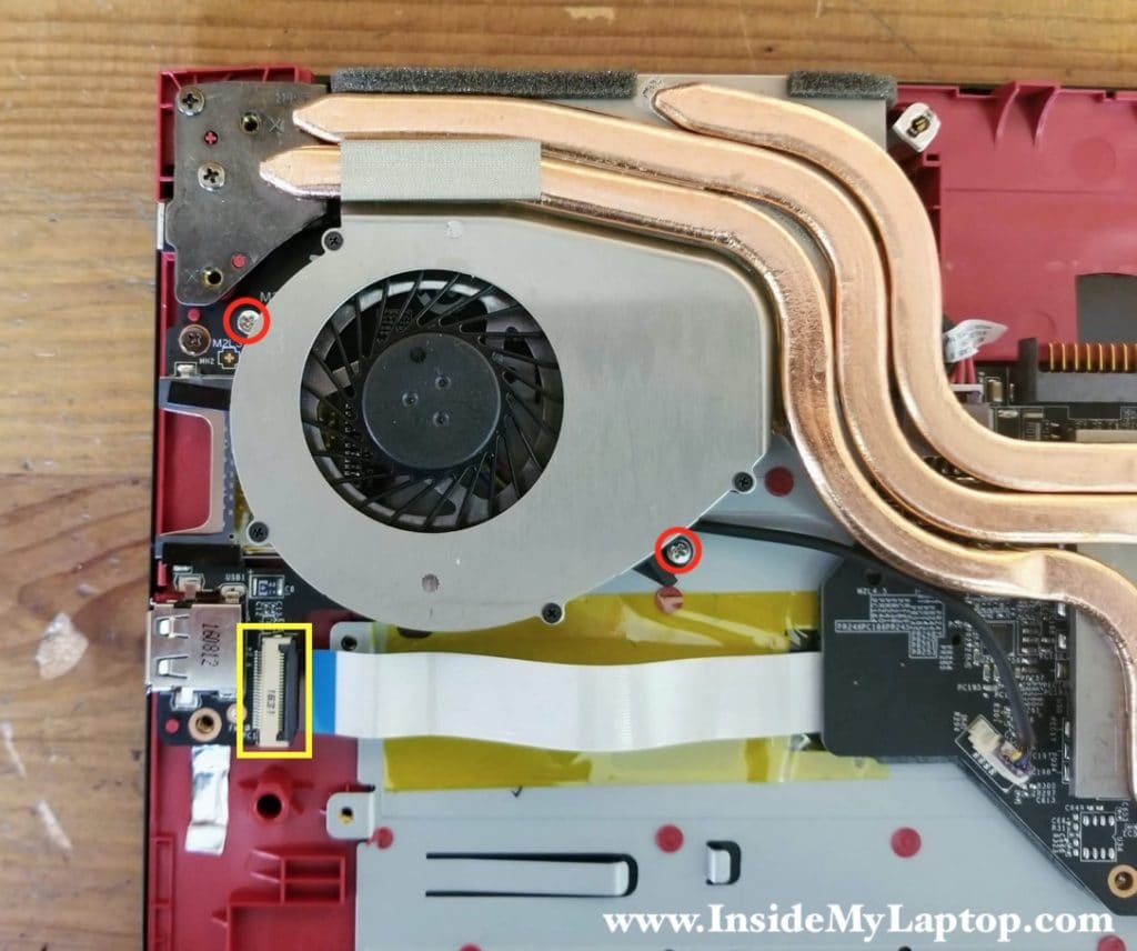 Remove two screws securing the right cooling fan. Disconnect the I/O cable from the USB SD card reader board.