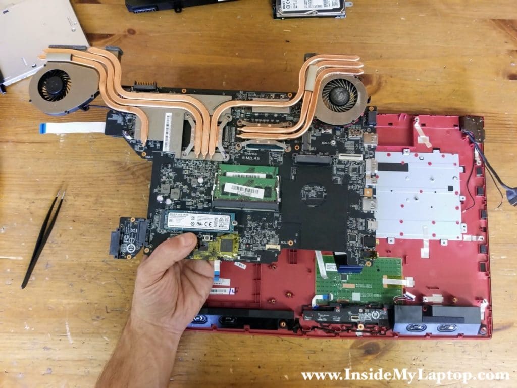 Remove the motherboard assembly.