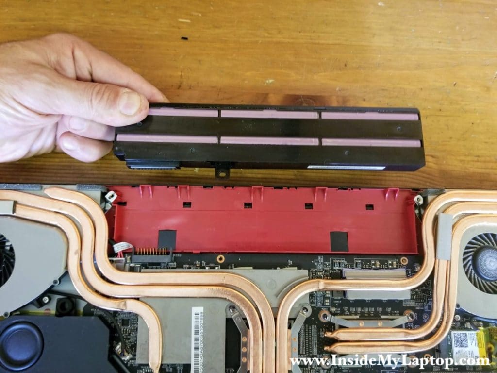 Lift up the battery to disconnect it from the motherboard. Remove the battery.