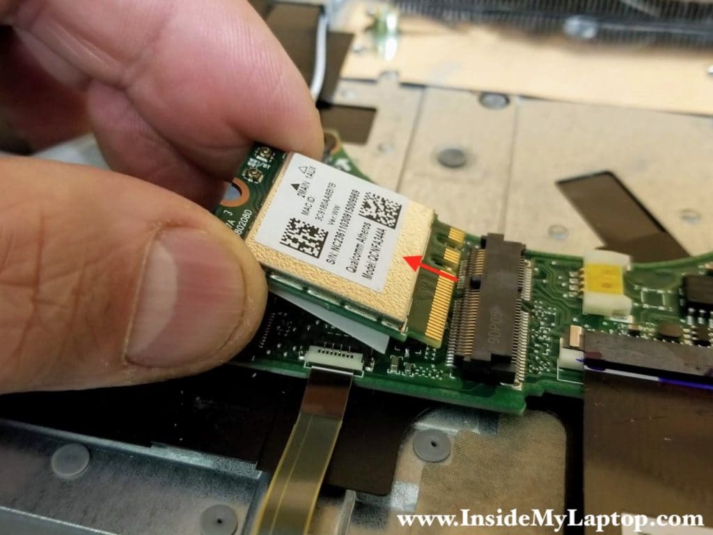 Remove one screw securing the wireless card. Pull the wireless card out of the slot.