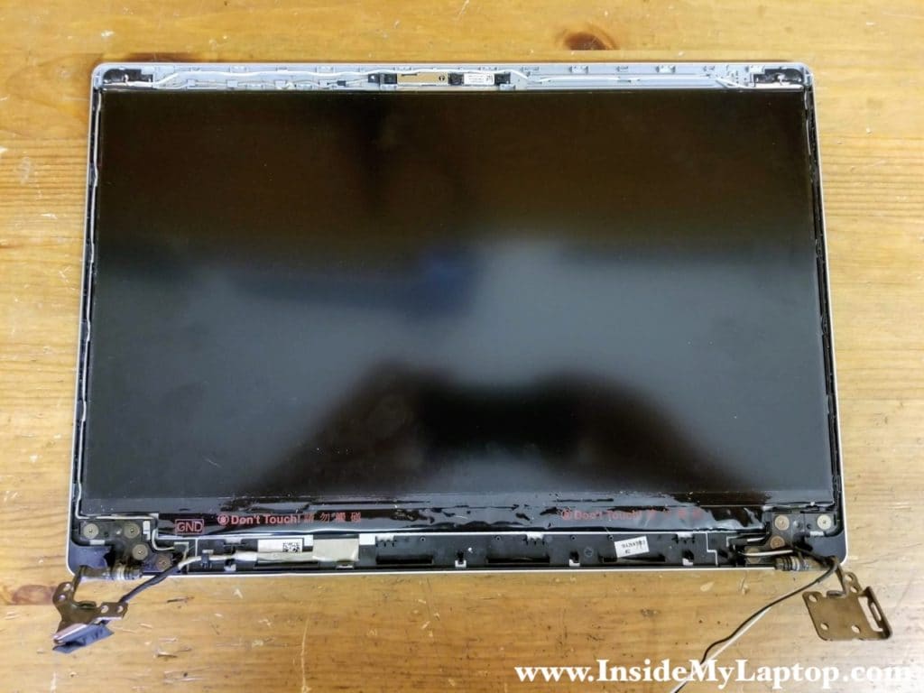 When the bezel was removed, I found that the LCD screen is glued to the display cover.