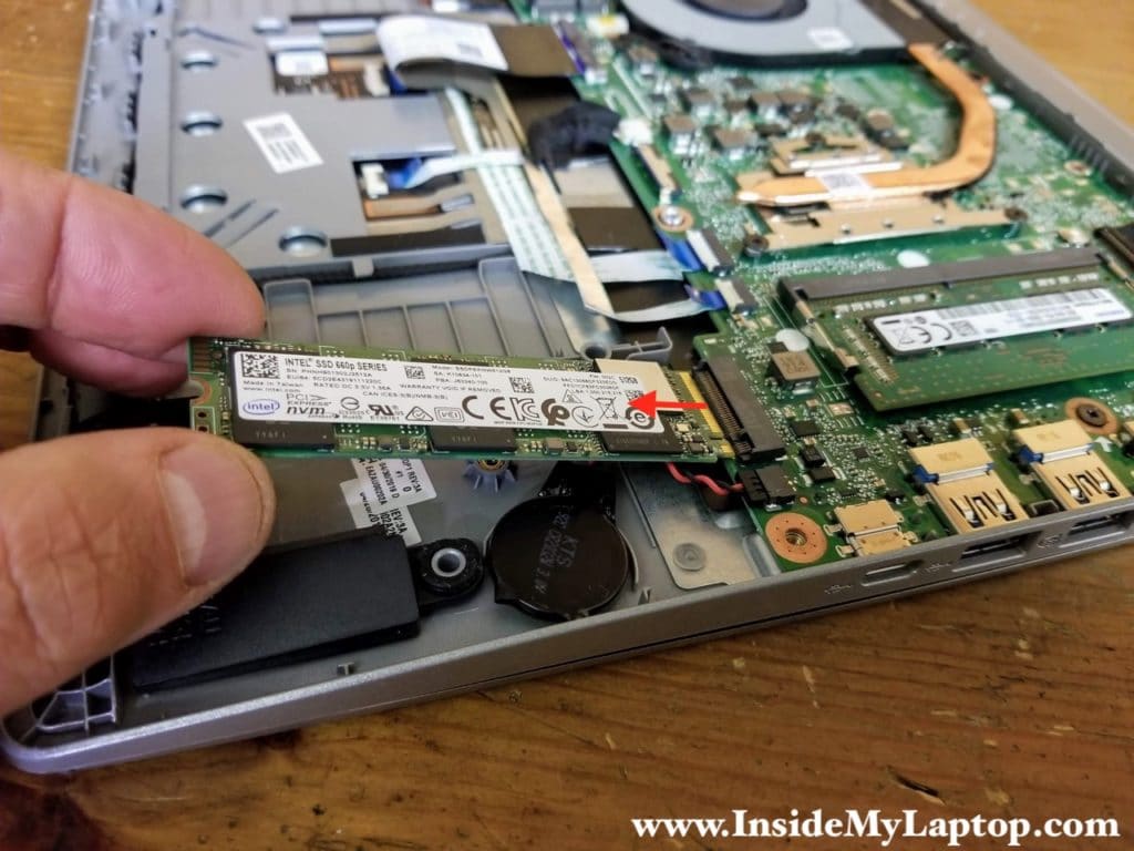 Remove one screw securing the PCIe NVMe M.2 solid state drive. Pull the SSD out.