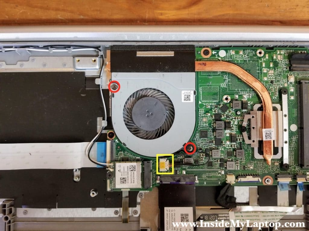 Remove two screws from the cooling fan. Disconnect the fan cable from the motherboard.