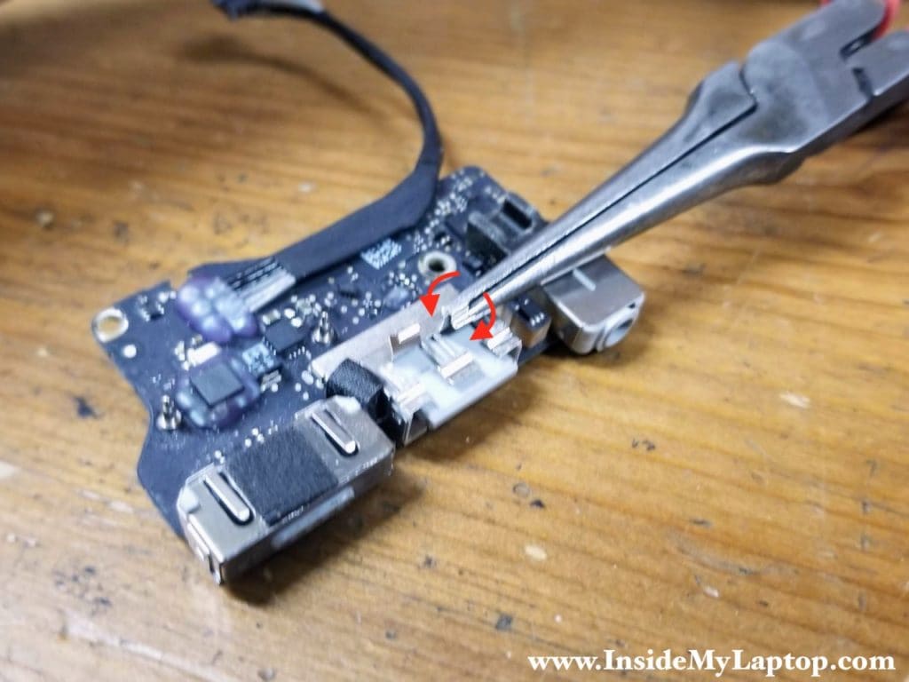 Grab the damaged strip with a need nose pliers and start turning it left and right until the strip breaks off cleanly.