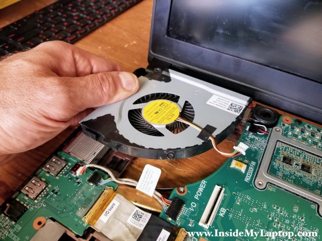 Lift up the left fan and disconnect it from the motherboard. Remove the left fan.