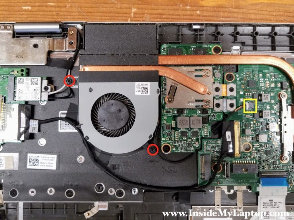 Remove two screws from the cooling fan and disconnect the fan cable.