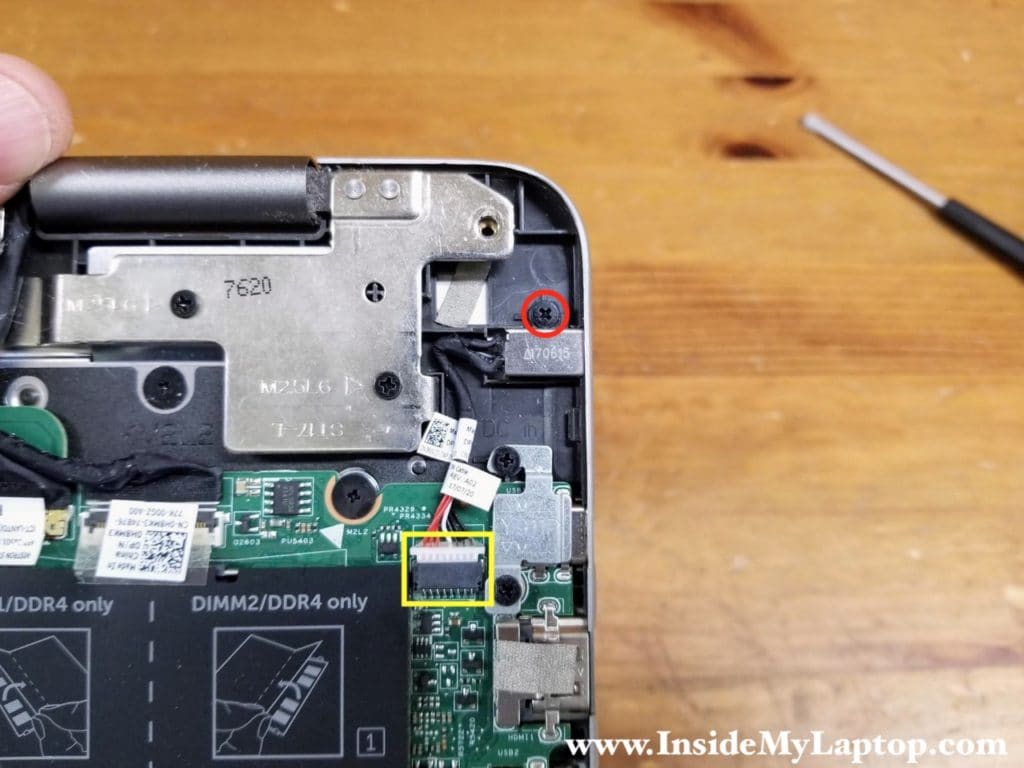 Remove one screws securing the DC power jack. Disconnect the DC jack cable from the motherboard.