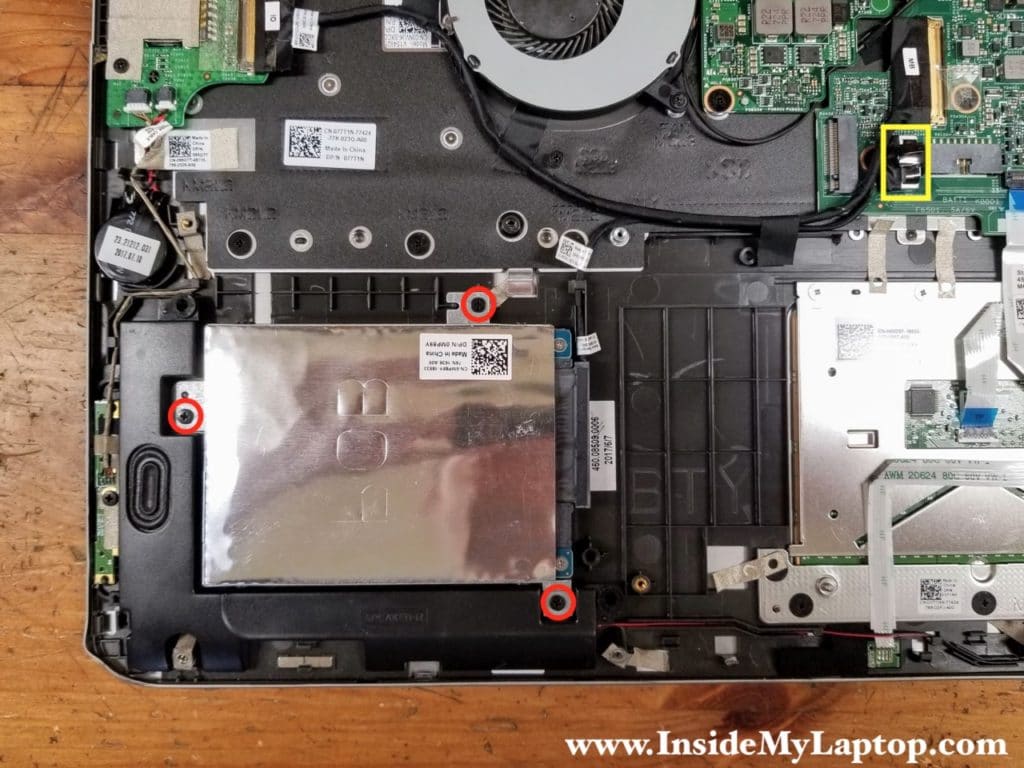 Remove three screws from the 2.5" hard drive bracket and disconnect the cable.