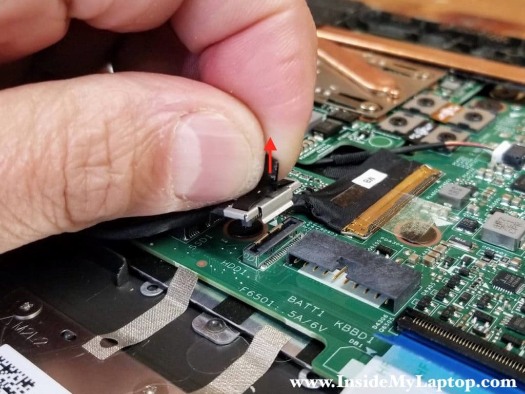 Pull the hard drive cable connector up to unplug it from the motherboard.