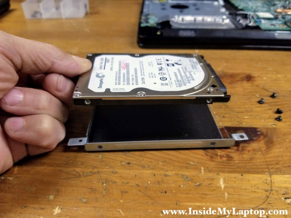 Remove the old hard drive from the caddy.