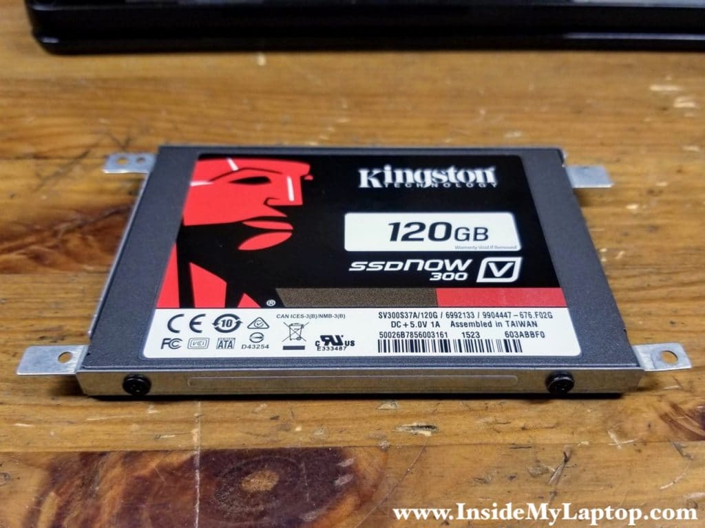 Install a new 2.5" SSD into the caddy and secure it with four screws.