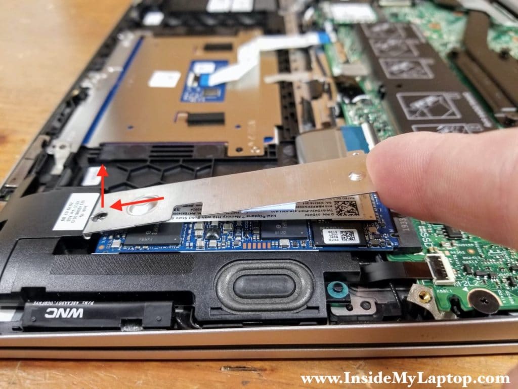Carefully separate one side of the SSD shield and push it to the left.