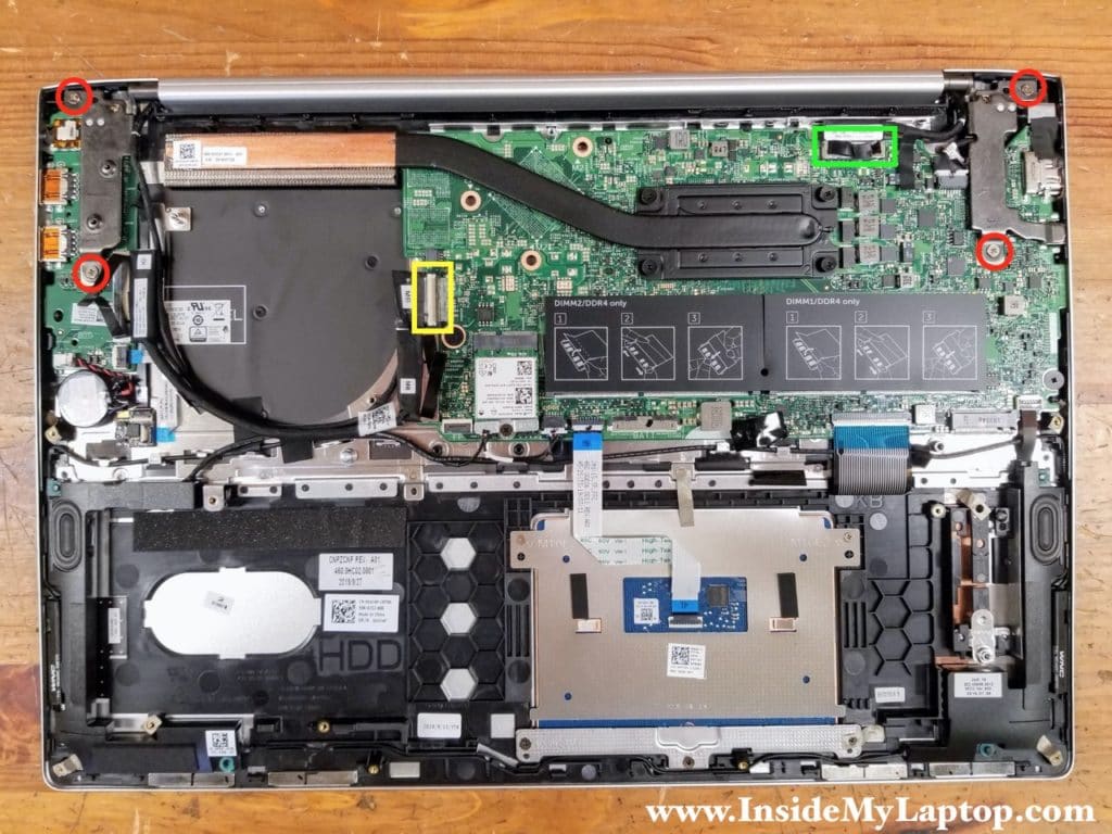 Remove four screws securing the display hinges and disconnect two cables.