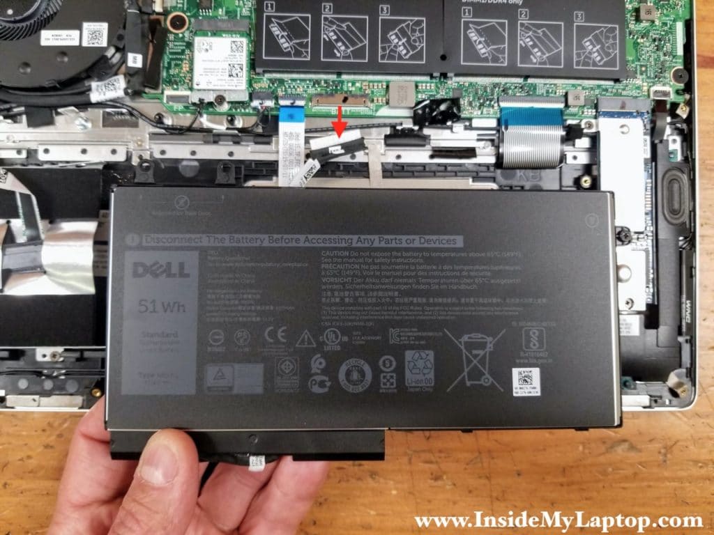 Lift up the battery and disconnect the cable. Remove the battery.