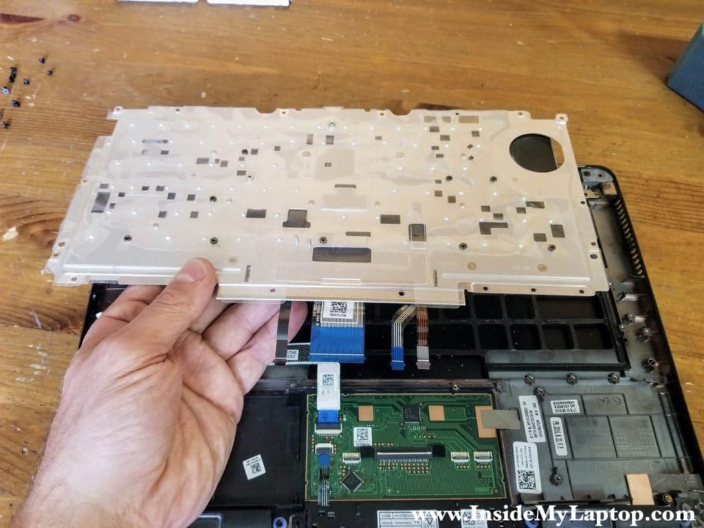 Separate the keyboard assembly from the top case.