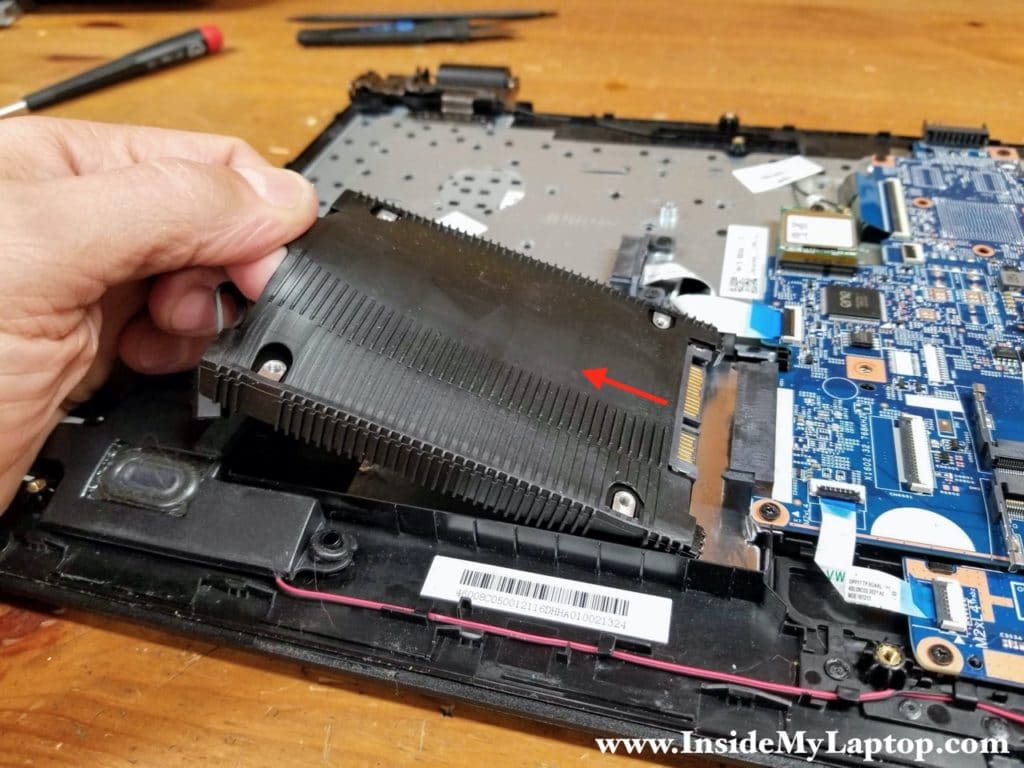 Lift up the left side of the hard drive and pull it out of the SATA port.