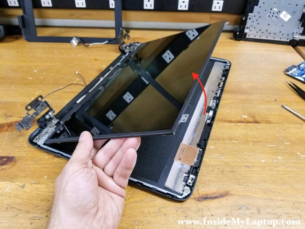 Separate the LCD screen from the display cover and place it upside down on the desk.