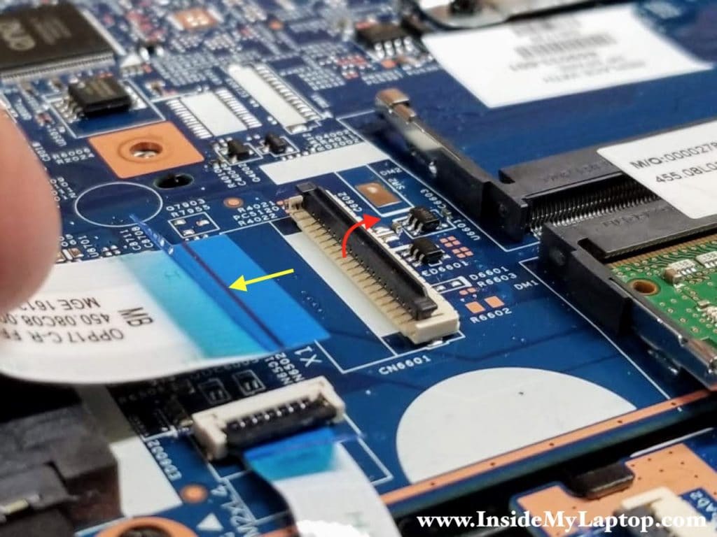 Here's how to disconnect the I/O cable (and most other cables) from the motherboard.