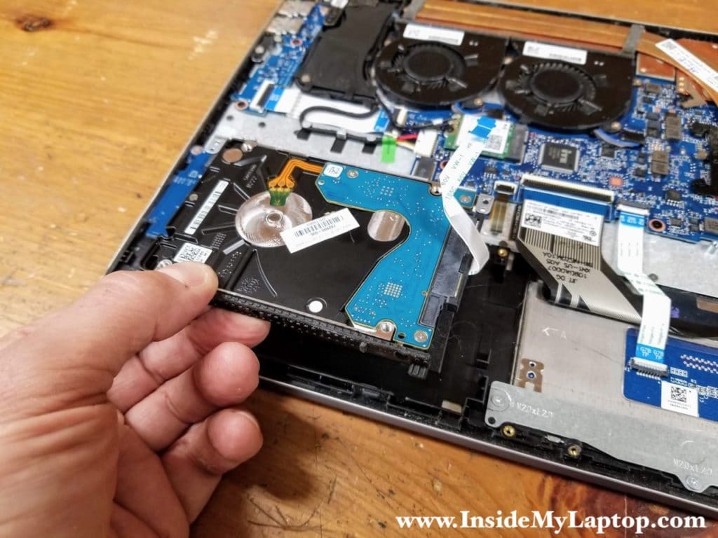 Lift up and remove the 2.5" hard drive with the cable attached to it.