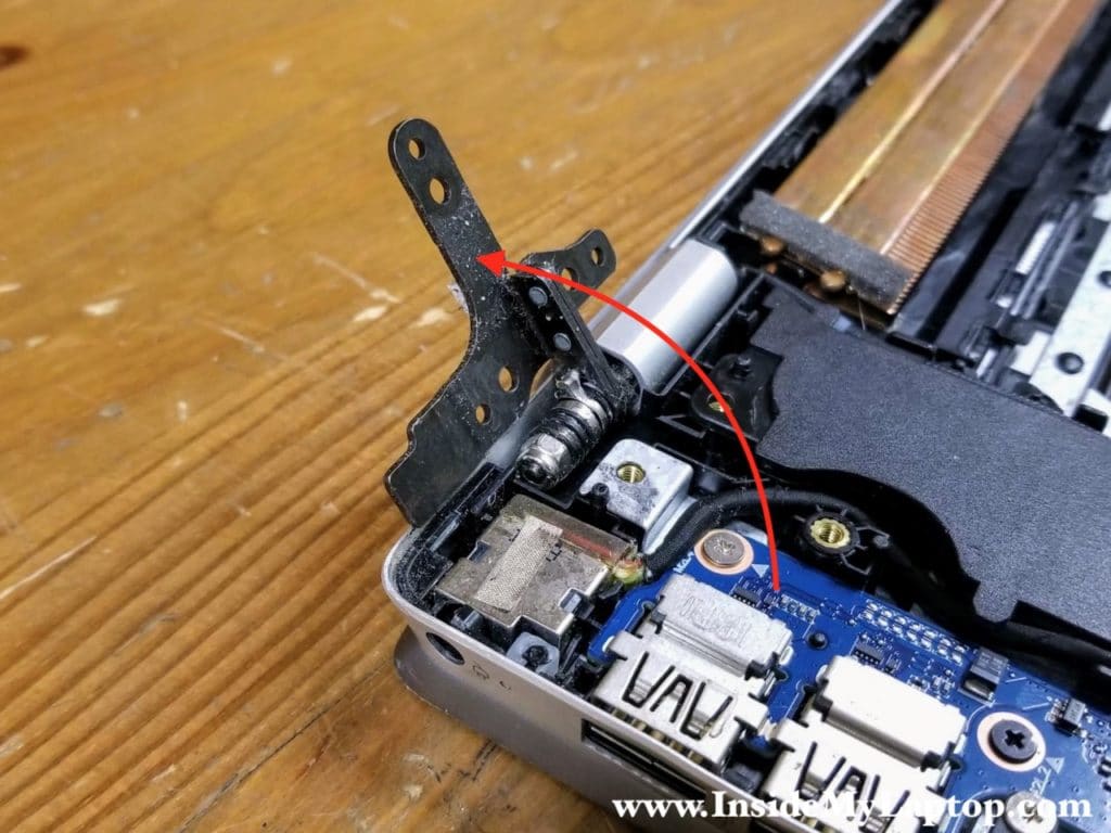 Lift up the right display hinge. Now we can access the DC power jack.