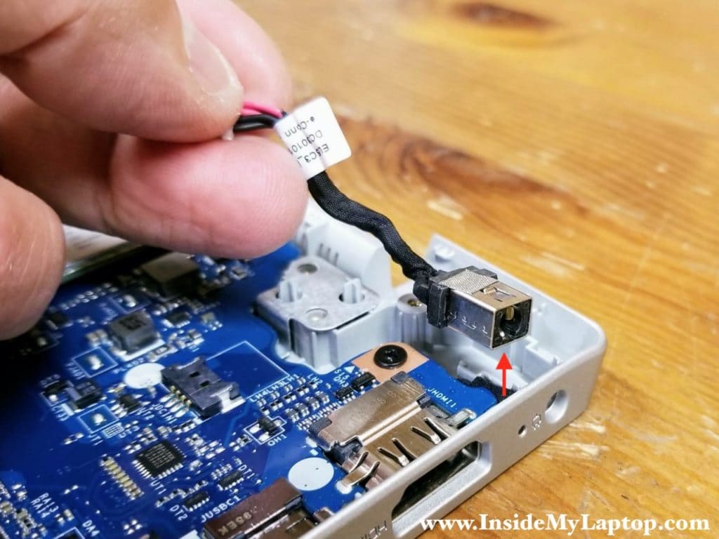 Unplug the DC jack cable from the motherboard and remove it.