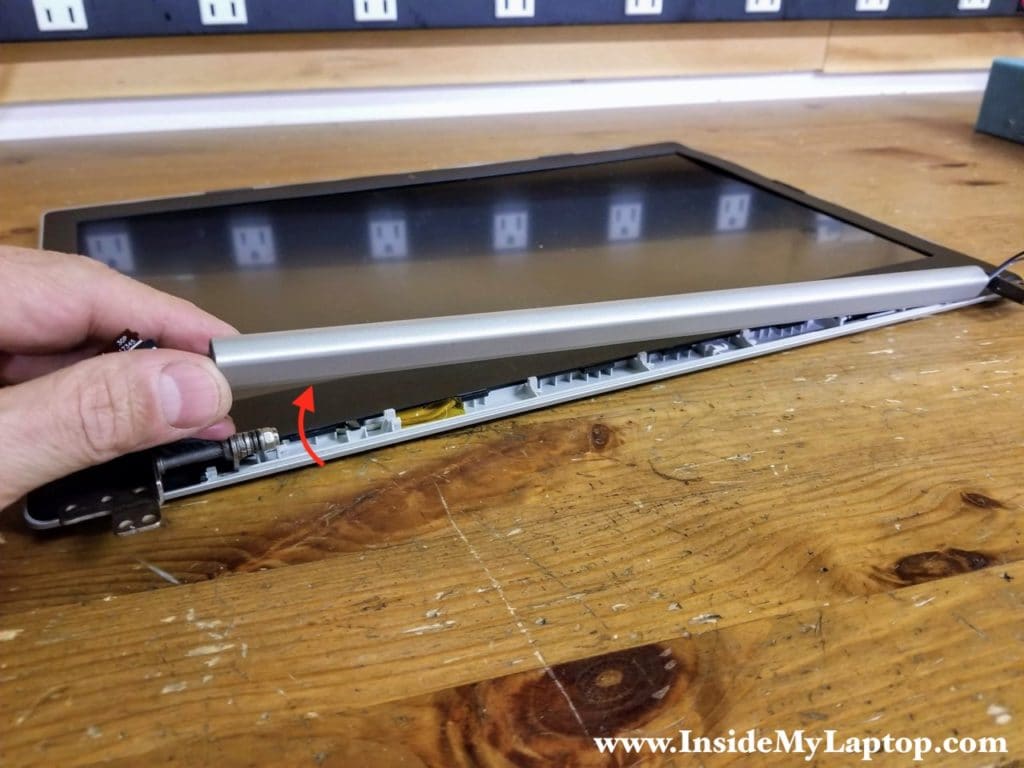 Lift up and remove the hinge cover.