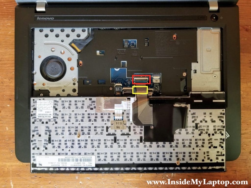 Place the keyboard upside down on the palmrest to access two cable connectors underneath.