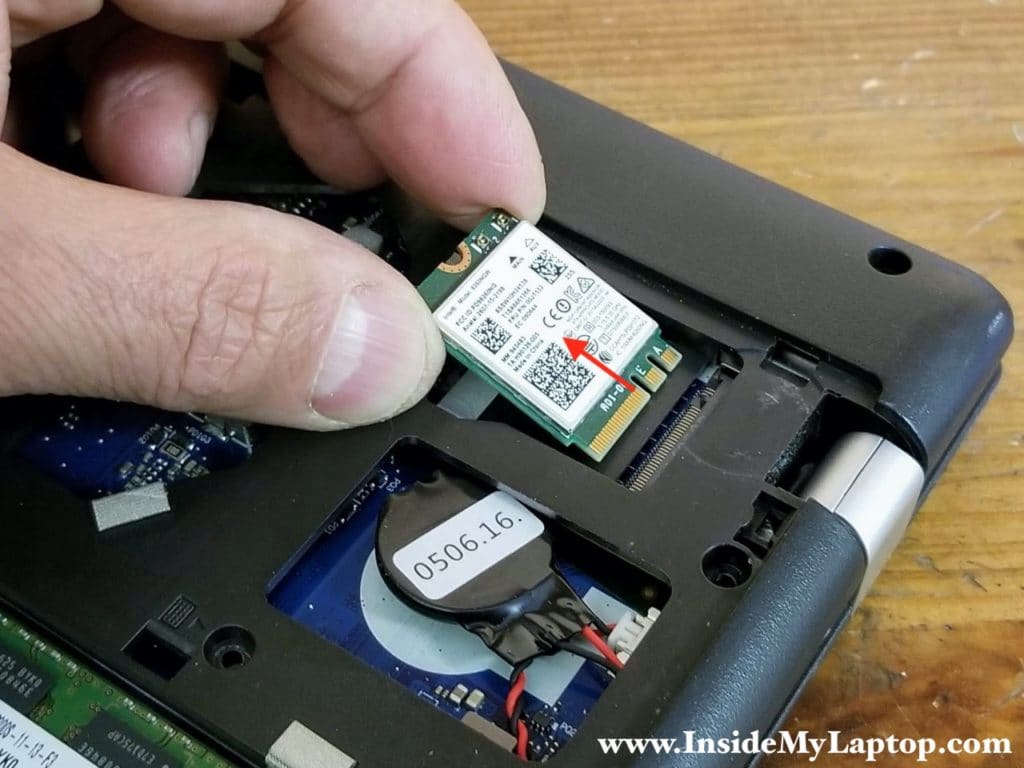 Remove one screw securing the wireless card and pull it out.