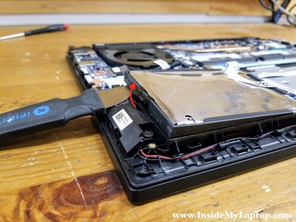 Pry up the back side of the hard drive and separate it from the top case.