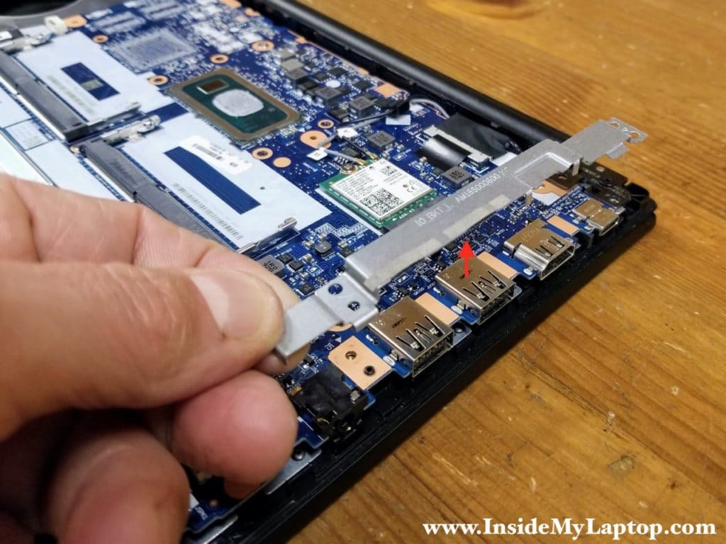 Lift up and remove the I/O board bracket.