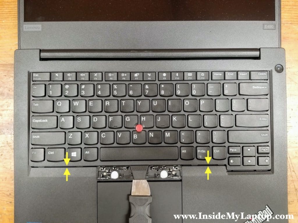 You know you've done it properly when you see the top row keys touching the bezel and about 1/8" gap on the bottom.