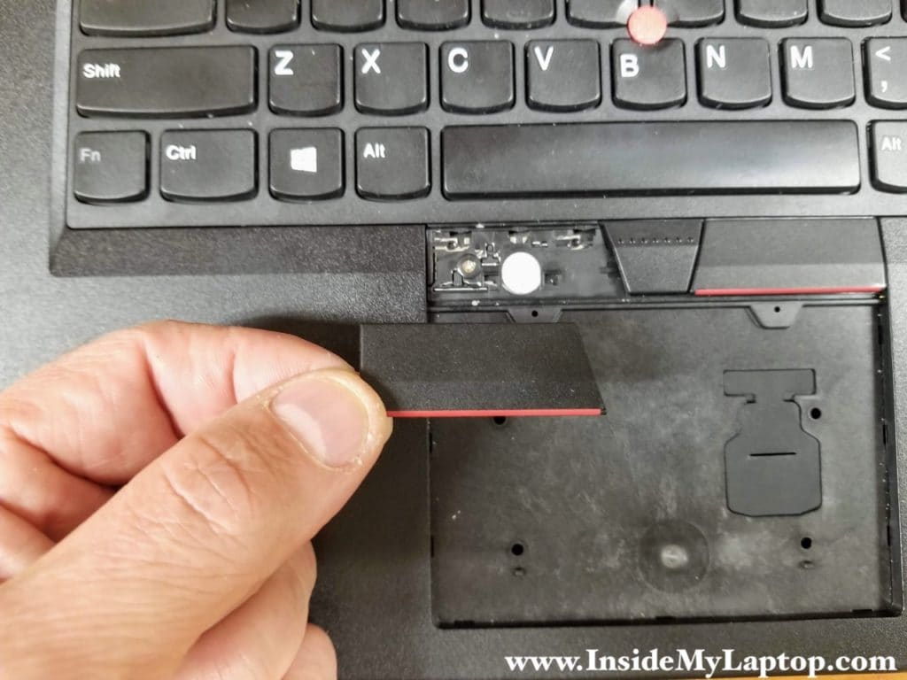 Remove the left touchpad key. Do the same with the right key.
