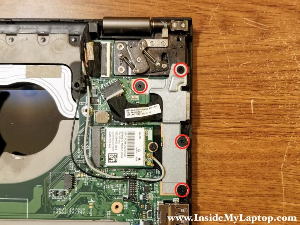 Remove four screws from the DC jack bracket.