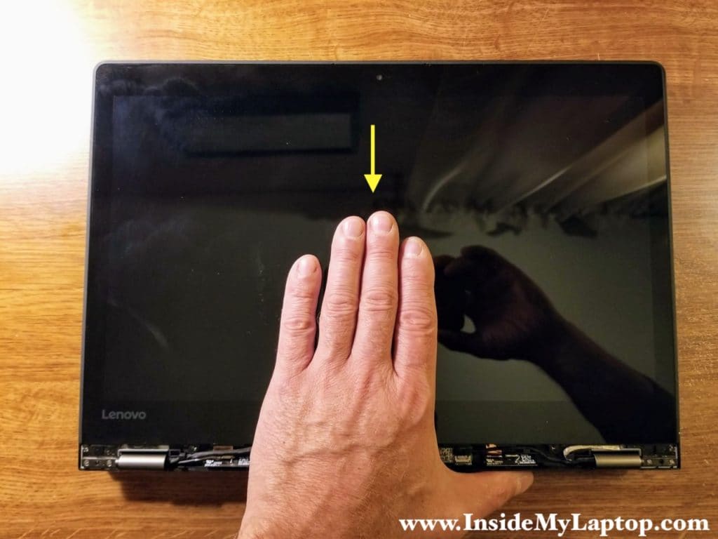 Move the touch screen assembly about 1/8 of an inch towards the hinges.
