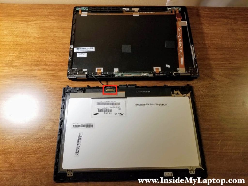 Now you can access and disconnect the display cable from the back of the LCD screen.