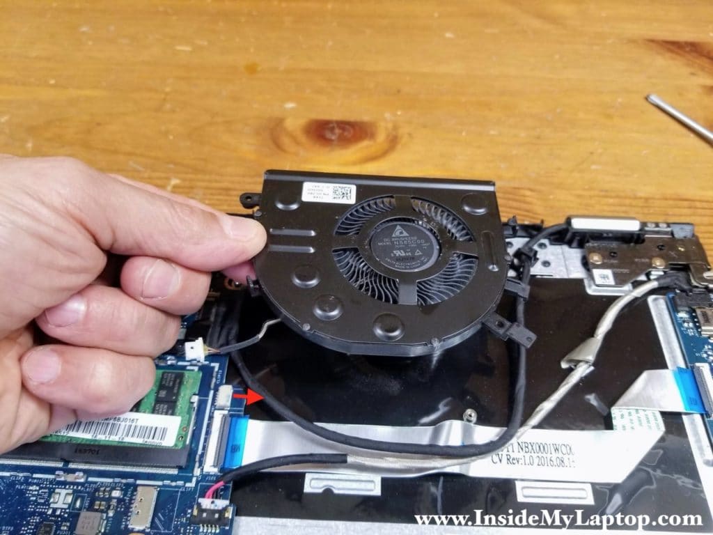 Lift up the cooling fan and disconnect the fan cable from the motherboard.